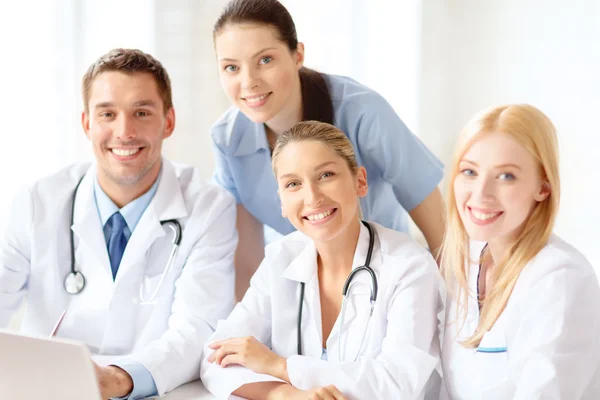 depositphotos_43327455-stock-photo-group-of-doctors-with-laptop